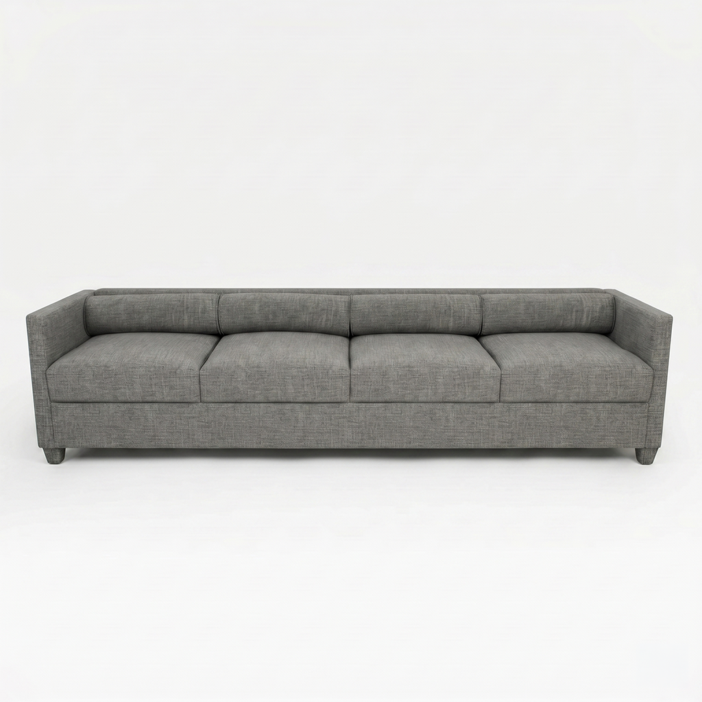 Long gray fabric sofa with three seat cushions and a low back in a minimalist studio setting, frontal view?nd a neutral backdrop; likely a three-seater.