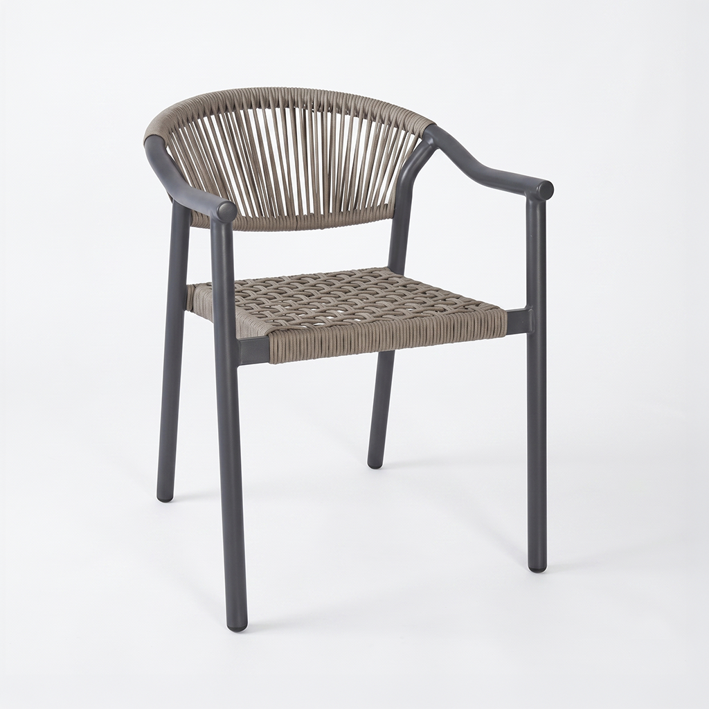 Outdoor chair with a dark frame and tan woven rope seat and backrest, curved arm supports visible on both sides.]